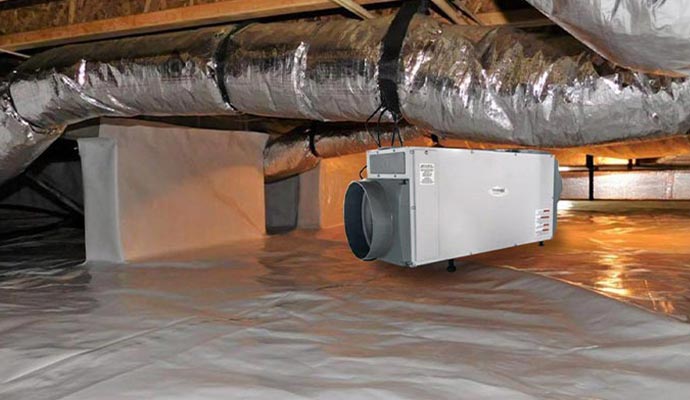 a crawl space with a dehumidifier installed