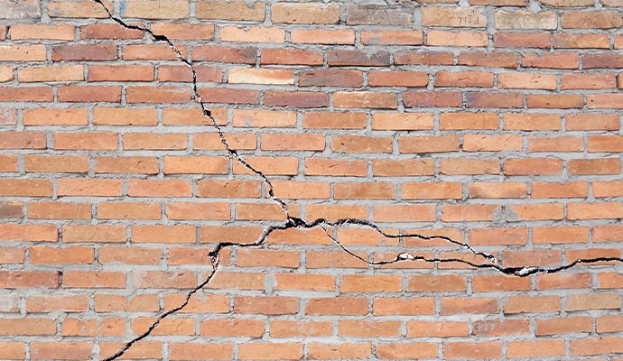 deep and wide crack across the wall