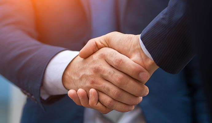 two businessman shaking hands